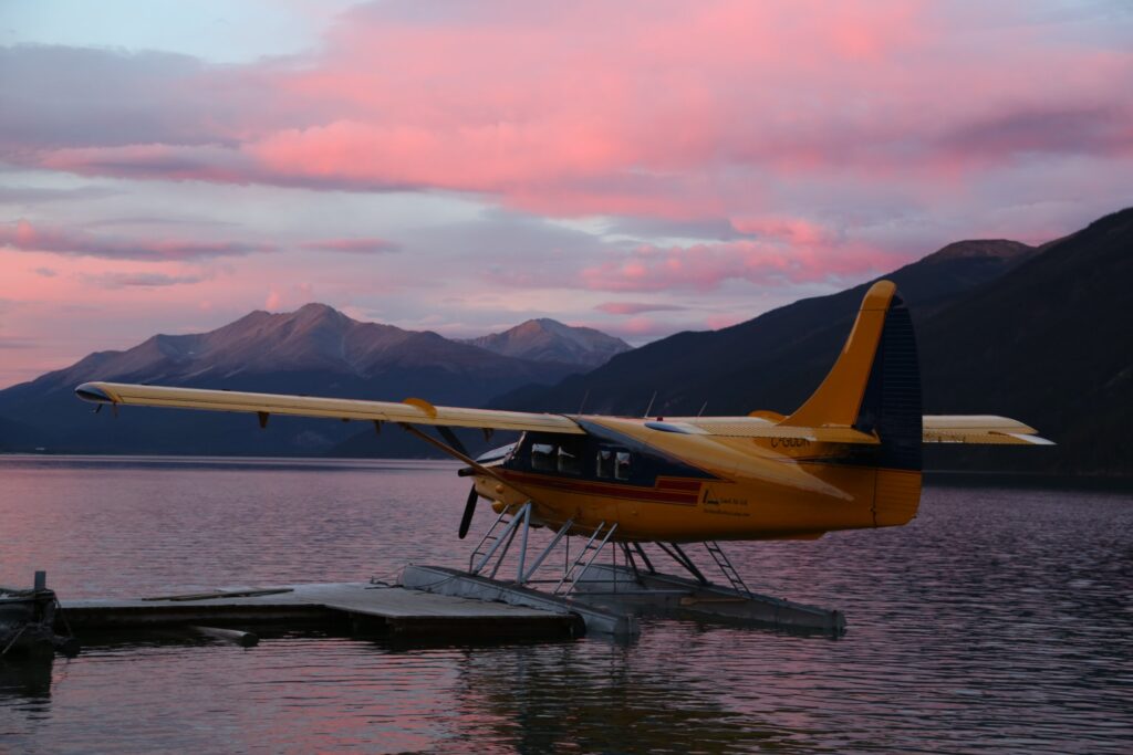 Floatplane at the dock on Muncho Lake at dusk